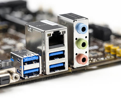 PCB board close-up showing RJ45 Ethernet connector, USB 3.0 interface, and 3.5mm audio jack port